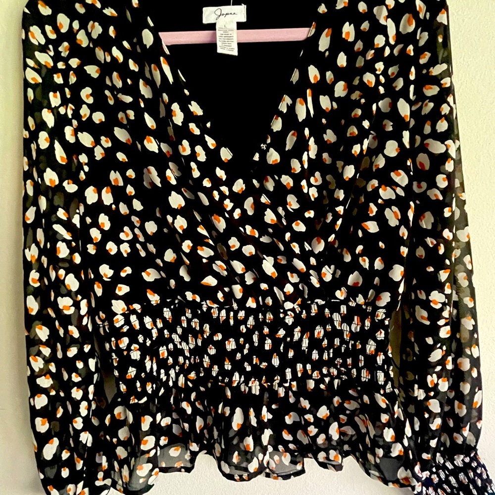 Jopna blouse black with white/tan flowers. Never worn.